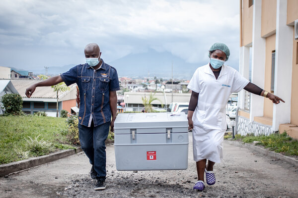 Carrying a box of vaccines this spring in Goma, in the Democratic Republic of Congo. The country received 1.7 million AstraZeneca doses through Covax in March, but distribution is another challenge.