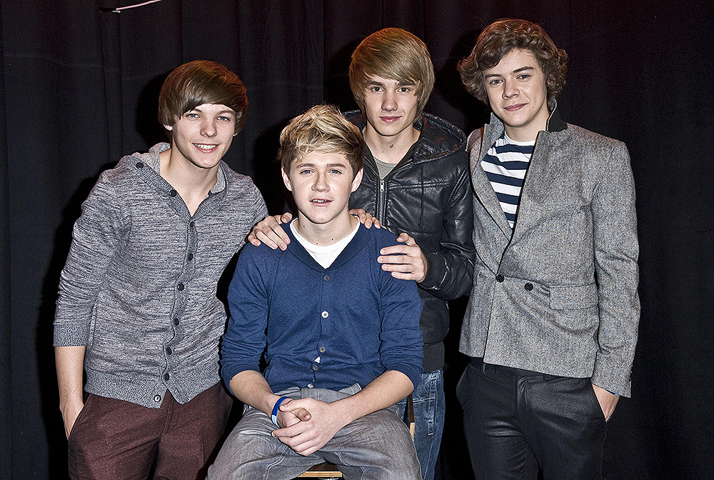 Talk Talk Secret Gig - London.Four of the five members of One Direction, left to right: Louis Tomlinson, Niall Horan (seated) Liam Payne and Harry Styles at a secret X factor gig, sponsored by Talk Talk, at the Hospital in London. Picture date: Wednesday December 01, 2010. Photo credit should read: Ian West/PA Wire URN:9859858 (Press Association via AP Images)