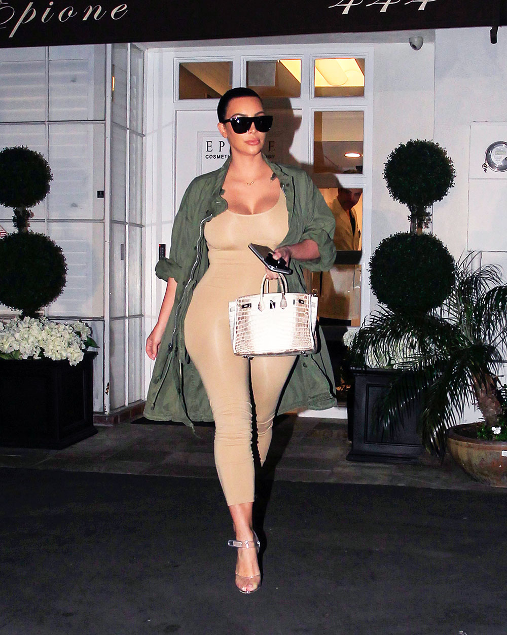 Reality star Kim Kardashian spotted out and about in Los Angeles, California. Kim accentuated her curves in a fitted beige bodysuit and carried a crocodile pattern purse. 02 Mar 2016 Pictured: Kim Kardashian. Photo credit: MEGA TheMegaAgency.com +1 888 505 6342 (Mega Agency TagID: MEGA26992_001.jpg) [Photo via Mega Agency]