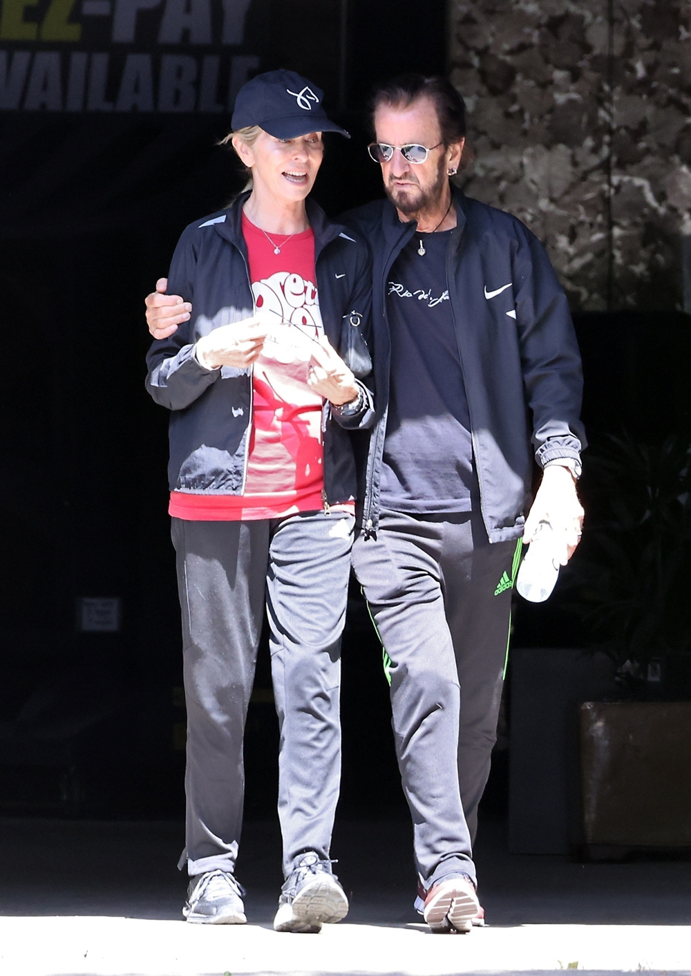 Los Angeles, CA  - *EXCLUSIVE*  - PICS TAKEN: 06/14/2022Beatles drummer Ringo Starr is seen with his wife Barbara Bach wearing matching black colored tracksuits as they shop for Plants at a nursery in Van Nuys. Ringo and Barbara have been married for over 40 years and Ringo who was about to start a North American tour has had to cancel on news that one of his bandmates has contracted Covid.Pictured: Ringo Starr, Barbara BachBACKGRID USA 11 JULY 2022 USA: +1 310 798 9111 / usasales@backgrid.comUK: +44 208 344 2007 / uksales@backgrid.com*UK Clients - Pictures Containing ChildrenPlease Pixelate Face Prior To Publication*